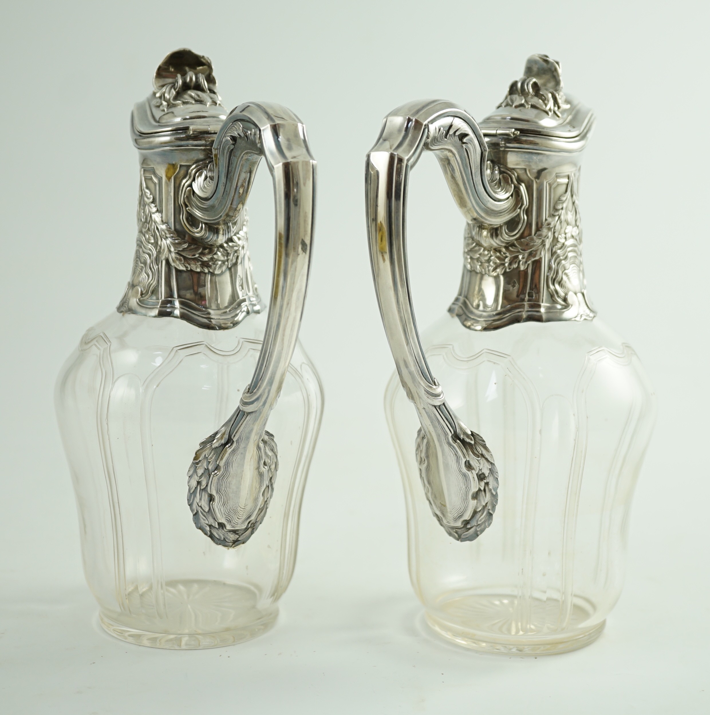 A pair of early 20th century French 950 standard silver mounted glass claret jugs, by Risler & Carre